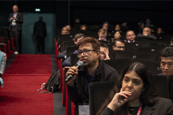 Someone asking a question during Housing Matters! 2024